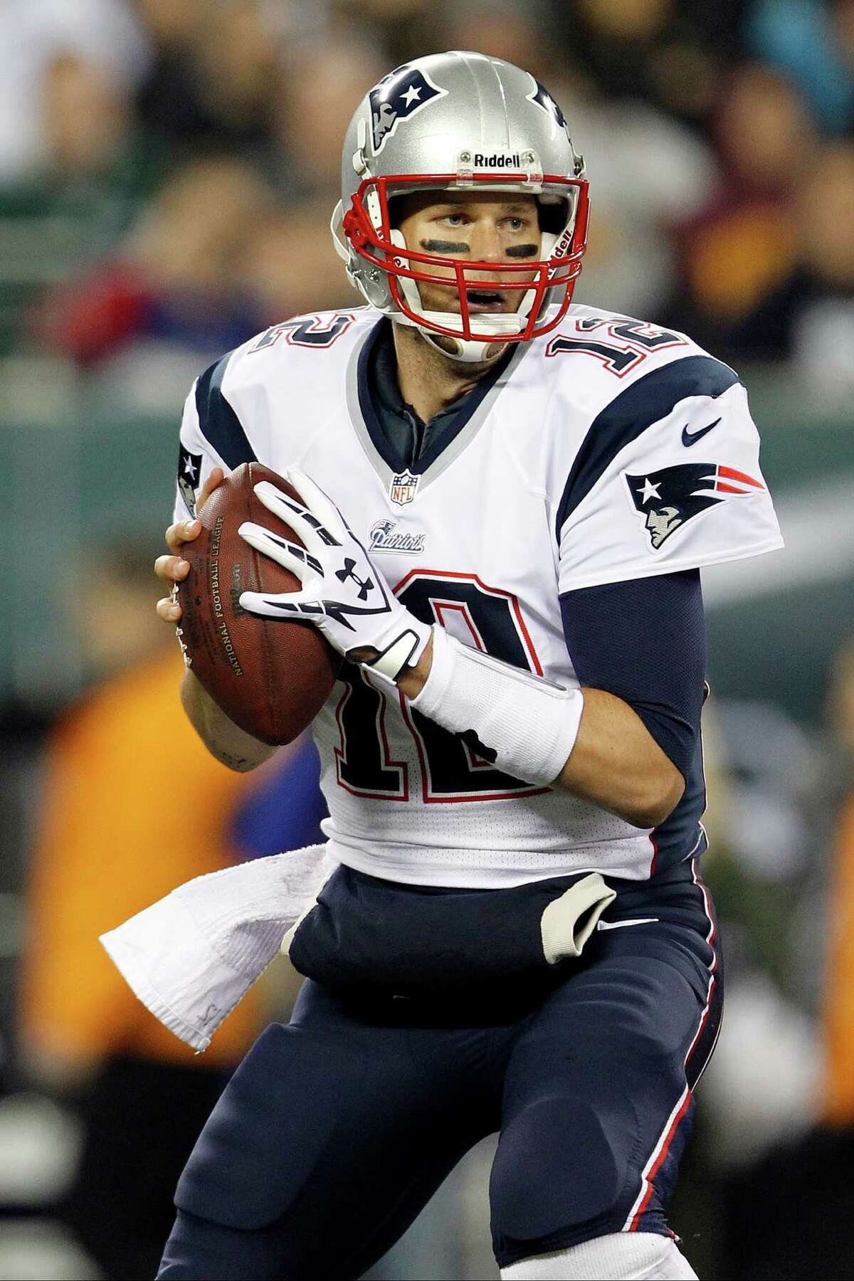 New England Patriots quarterback Tom Brady looks to pass in the