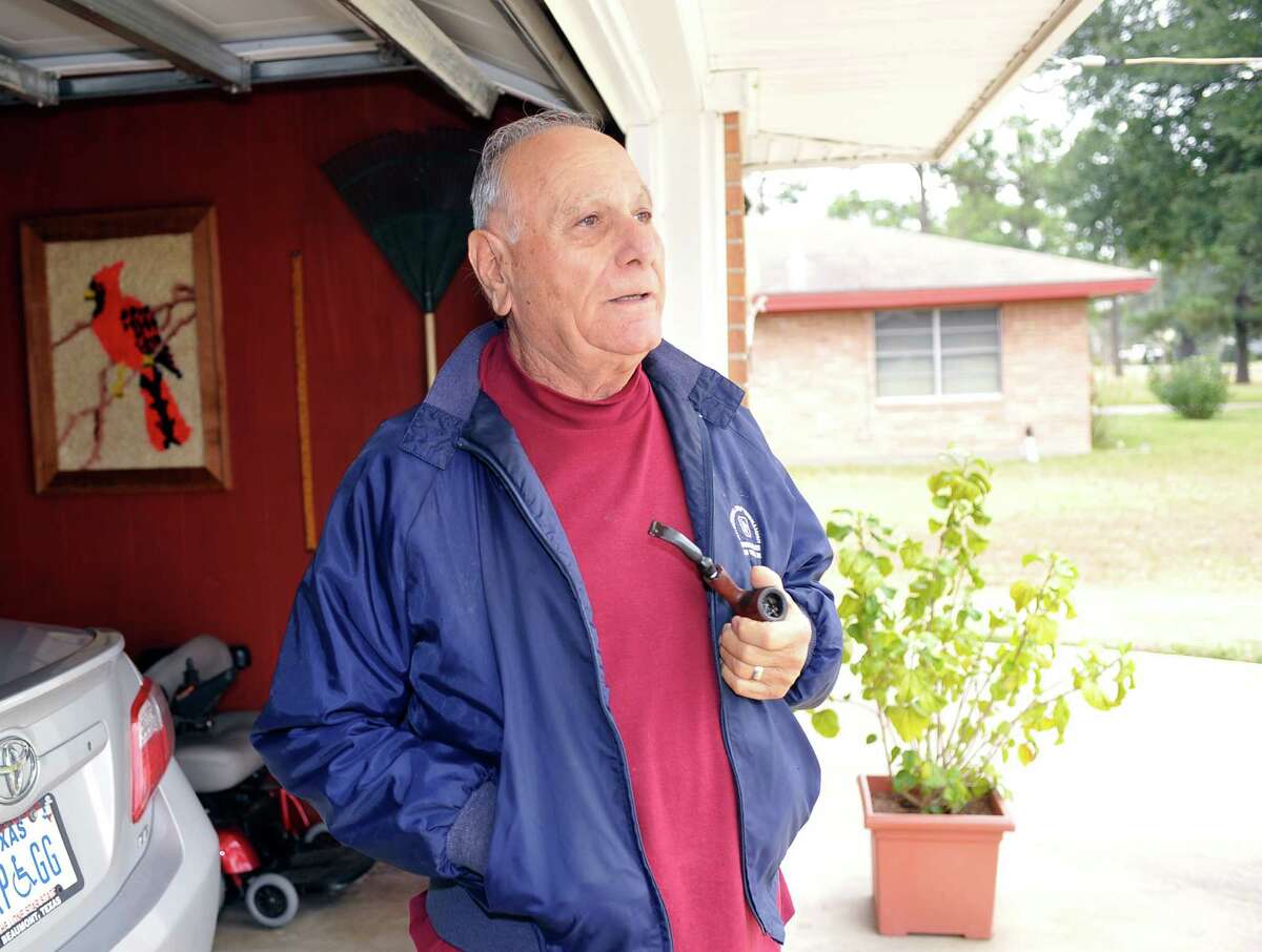 Carl Perricone, 83, is the last of the Perricone quadruplets, who, along with his brothers, garnered fame during the Great Depression as the world's first known set of male quadruplets. Friday afternoon, he took a moment to light up his pipe in the garage and gaze out onto Quad Street, which is a private drive off Walden Road that all his brothers lived on with him. Dave Ryan/The Enterprise
