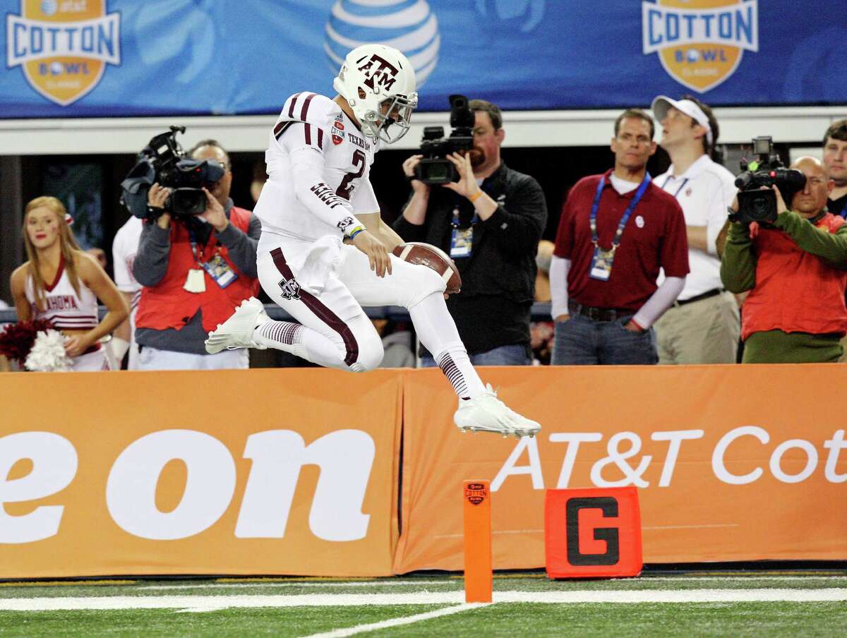 Texas A&M Aggies' Johnny Manziel scores a touchdown against the Oklahoma Sooners during first half action of the 77th AT&T Cotton Bowl Classic held Friday Jan. 4, 2013 at Cowboys Stadium in Arlington, Tx.