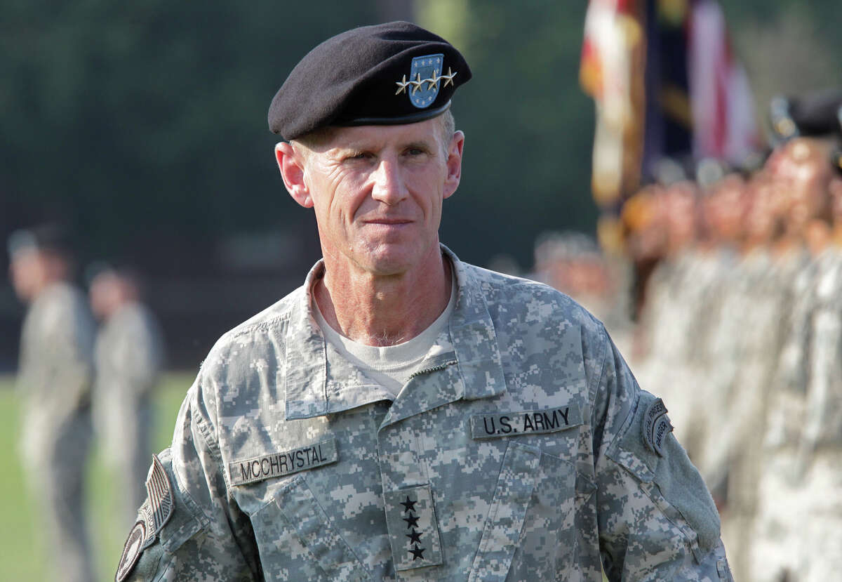 FILE - This July 23, 2010, file photo shows Gen. Stanley McChrystal reviewing troops for the last time as he is honored at a retirement ceremony at Fort McNair in Washington. Speaking out for the first time since he resigned, retired Gen. Stanley McChrystal writes in a new memoir that he takes the blame for the Rolling Stone article that ended his Afghan command and army career, including for the unflattering comments attributed to his staff about the Obama administration. (AP Photo/J. Scott Applewhite, file)