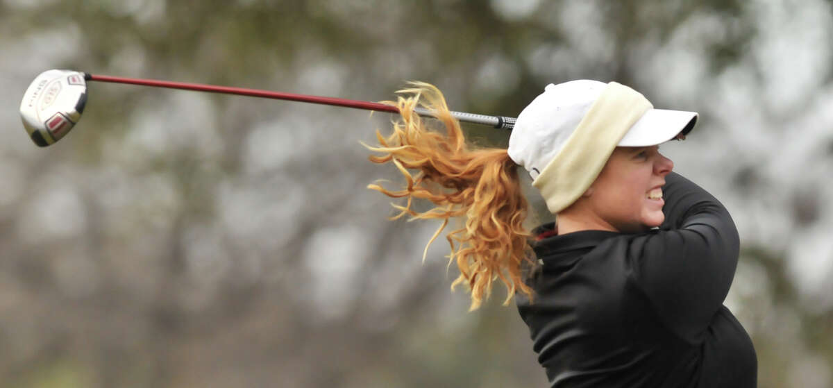 With her hair flying, Meghan Musk hits a tee shot at the first hole during the Greater San Antonio Tournament of Champions at Brackenridge Golf Course Saturday.