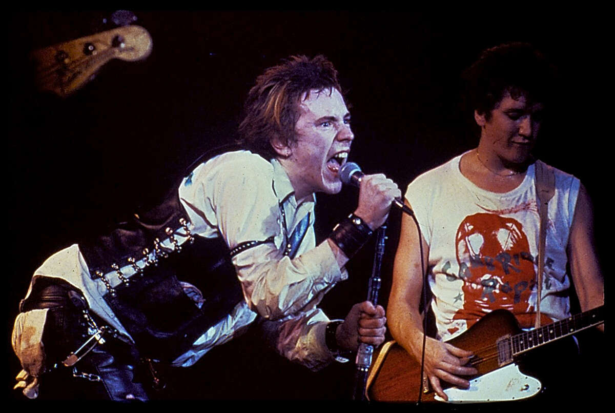 Sex Pistols guitarist Steve Jones (right) performs with John 'Johnny Rotten' Lydon.