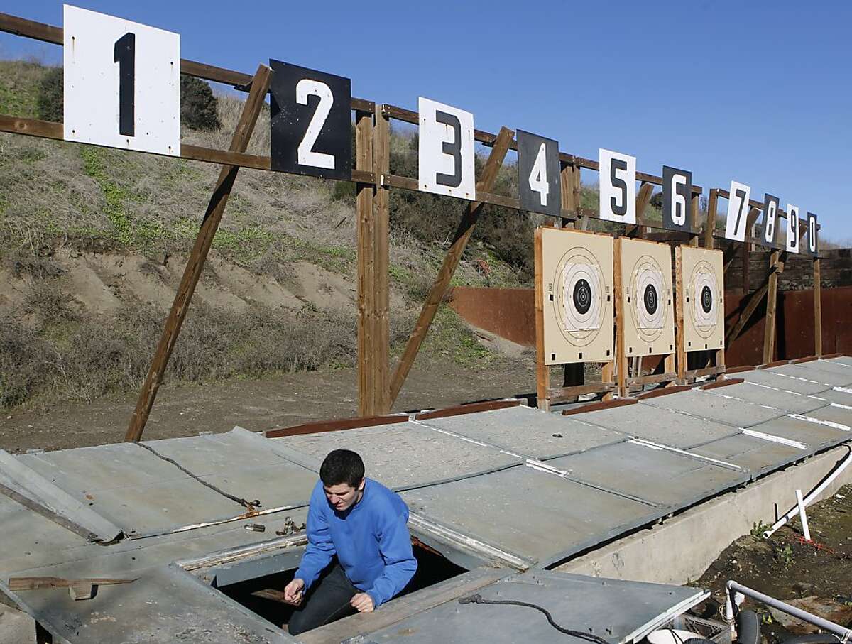 James MacMillan emerges from an area called "the pit" after setting targets during a training session for an upcoming shooting competition with his AR-15 semi-automatic rifle at the Richmond Rod & Gun Club in Richmond, Calif. on Saturday, Nov. 24, 2012.