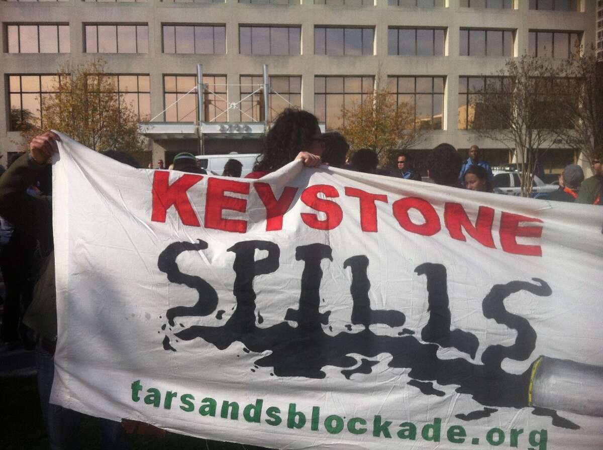 Scores of Keystone XL Pipeline protesters, led by the Tar Sands Blockade, protested oustide one of TransCanada's Houston offices.