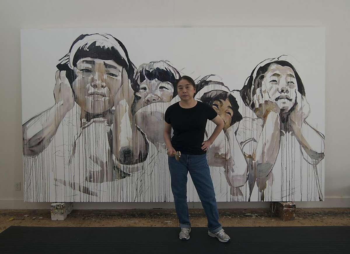 Artist Hung Liu, whose work is the subject of a retrospective at the Oakland opening in March, in front of her painting Jingzhe—First Spring Thunder, from 2010. Courtesy Hung Liu and Jeff Kelley. OLYMPUS DIGITAL CAMERA
