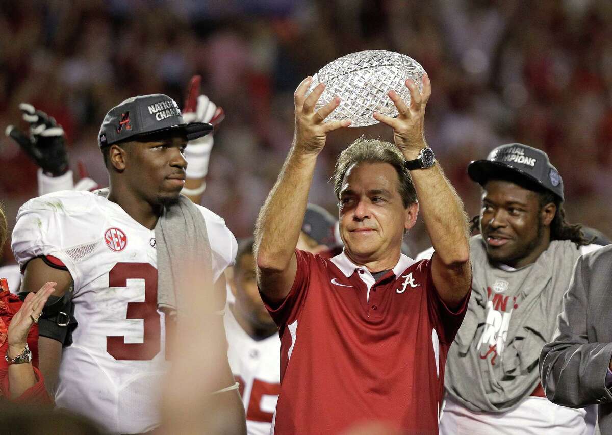 Alabama head coach Nick Saban holds up the championship trophy after the BCS National Championship college football game against Notre Dame Monday, Jan. 7, 2013, in Miami. Alabama won 42-14. (AP Photo/Chris O'Meara)