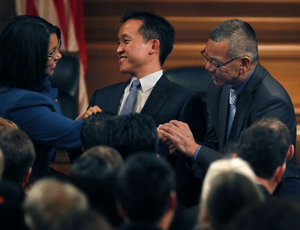 Incoming supervisors London Breed (left) and Norman Yee (right) congratualte one another after they were sworn-in as members of Board of Supervisors in San Francisco, Calif. on Tuesday, Jan. 8, 2013. David Chiu (center) was re-elected to serve as president of the board after he was sworn-in for his second term.