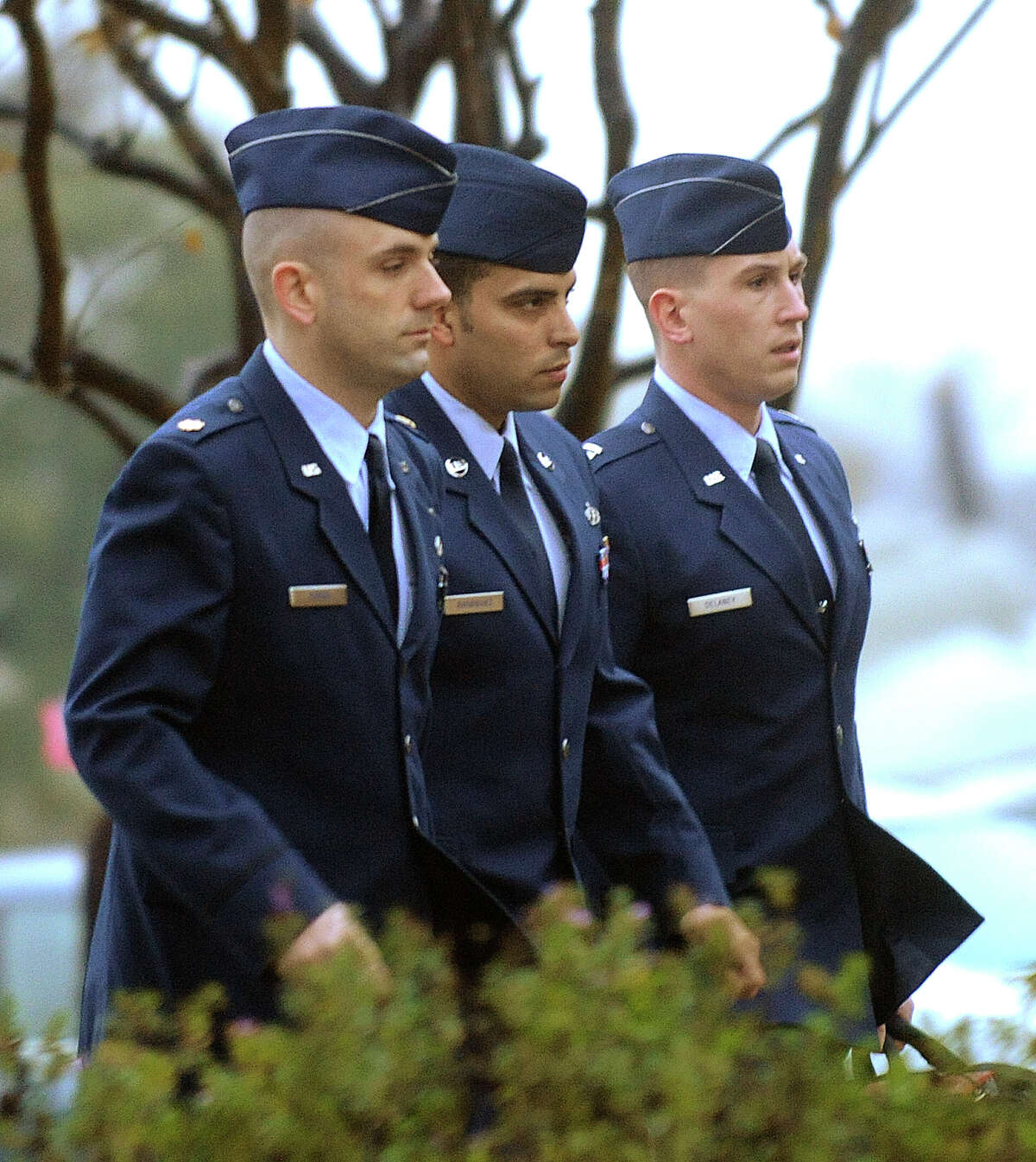 Air Force Tech. Sgt. Jaime Rodriguez (center) is accused of raping a woman in his recruiting office in Lake Jackson.