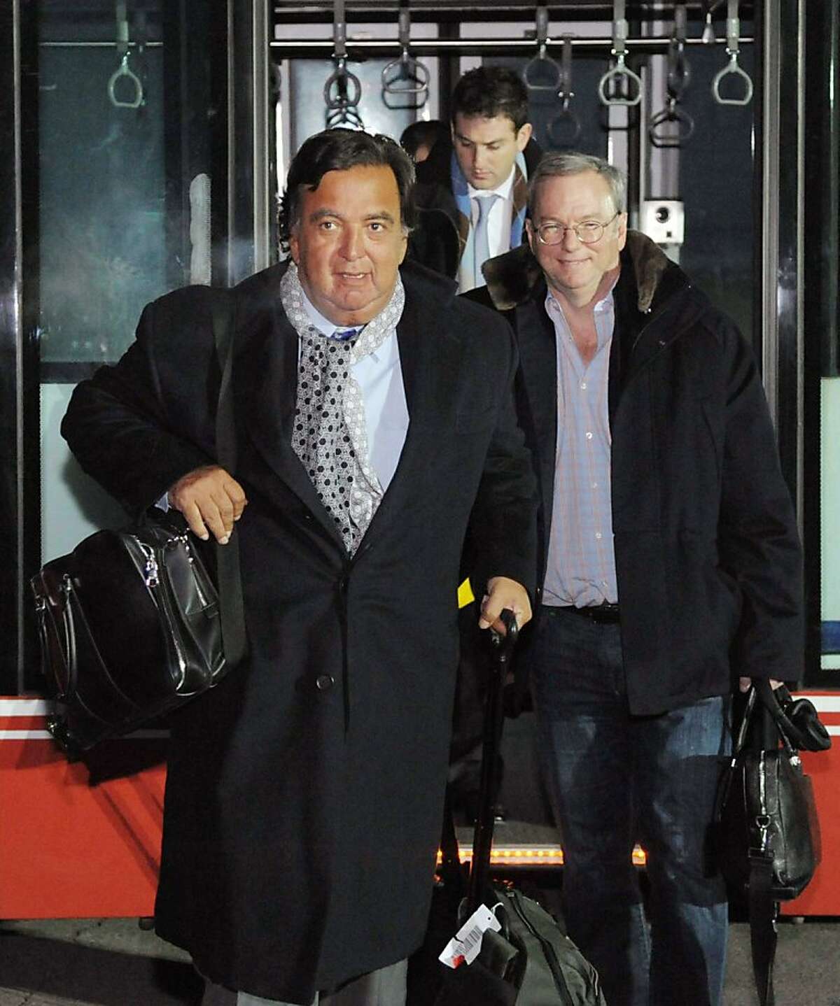 Eric Schmidt, executive chairman of Google, right, and former New Mexico Gov. Bill Richardson, left, arrive at an airport in Pyongyang, North Korea, Monday, Jan. 7, 2013. The Google chairman wants a first-hand look at North Korea's economy and social media in his private visit Monday to the communist nation, his delegation said, despite misgivings in Washington over the timing of the trip. (AP Photo/Kyodo News) JAPAN OUT, MANDATORY CREDIT, NO LICENSING IN CHINA, HONG KONG, JAPAN, SOUTH KOREA AND FRANCE