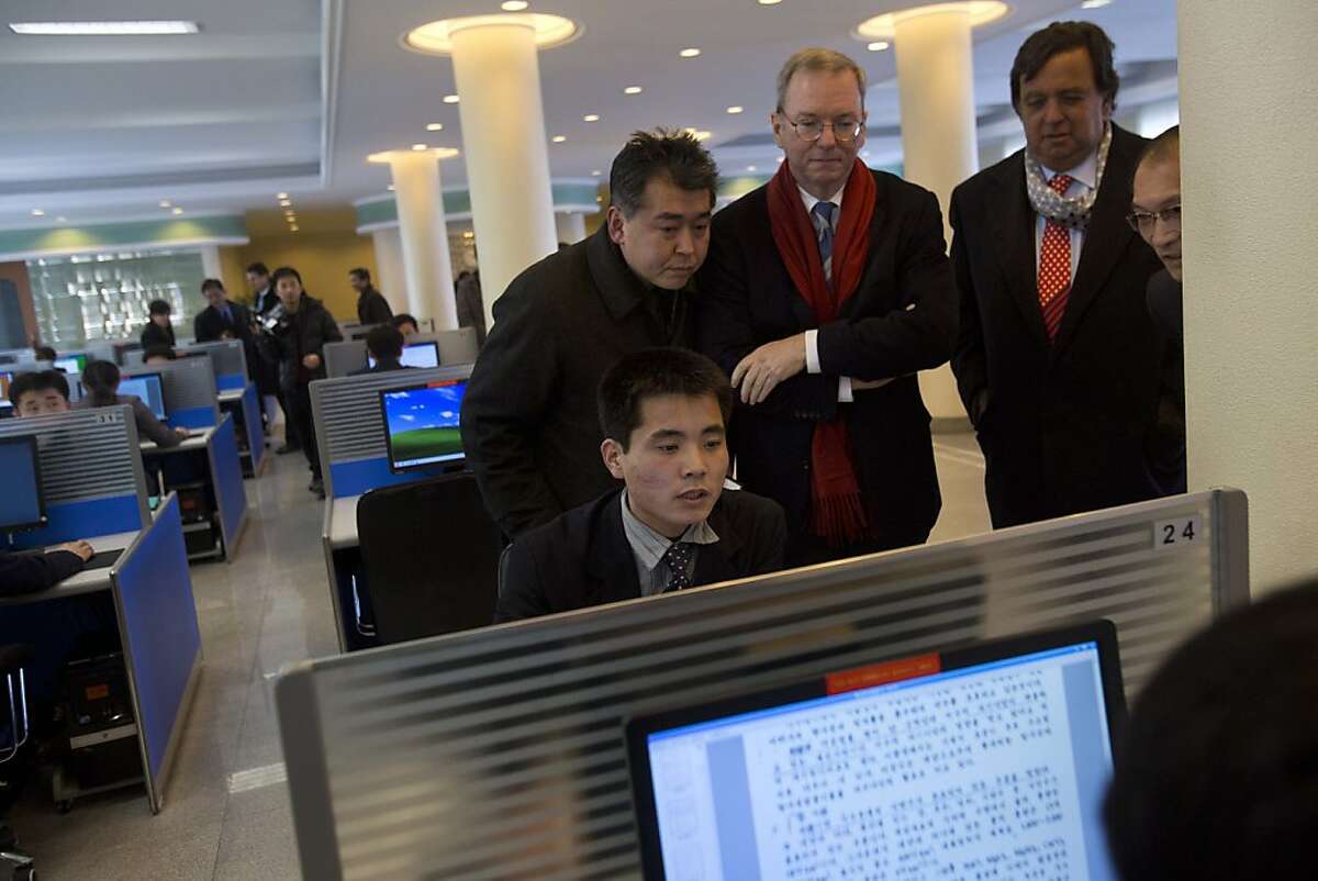 Executive Chairman of Google, Eric Schmidt, third from left, and former New Mexico governor Bill Richardson, second from right, watch as a North Korean student surfs the Internet at a computer lab during a tour of Kim Il Sung University in Pyongyang, North Korea on Tuesday, Jan. 8, 2013. Schmidt is the highest-profile U.S. executive to visit North Korea - a country with notoriously restrictive online policies - since young leader Kim Jong Un took power a year ago. (AP Photo/David Guttenfelder)