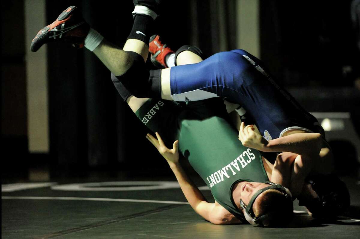 Schalmont's Matt Osborne, left, grapples with Cohoes' Sam Hill at 113 pounds during their wrestling match on Thursday, Jan. 3, 2013, at Schalmont High in Rotterdam, N.Y. (Cindy Schultz / Times Union)