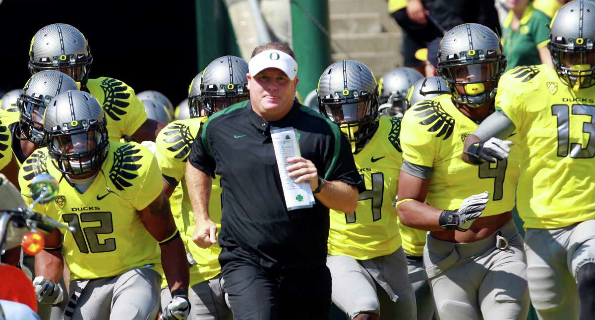 2. Oregon: Chip Kelly has officially returned, meaning the Ducks retain their most important element from this season's 12-1 team that didn't lose in regulation. The defense will be tougher with another year together, and the Ducks will have the Pac-12's most explosive offense with Marcus Mariota and De'Anthony Thomas back. PHOTO: Kelly runs on to the field with his team before the start of a game against Nevada, Sept. 10, 2011, in Eugene, Ore. Oregon defeated Nevada 69-20.