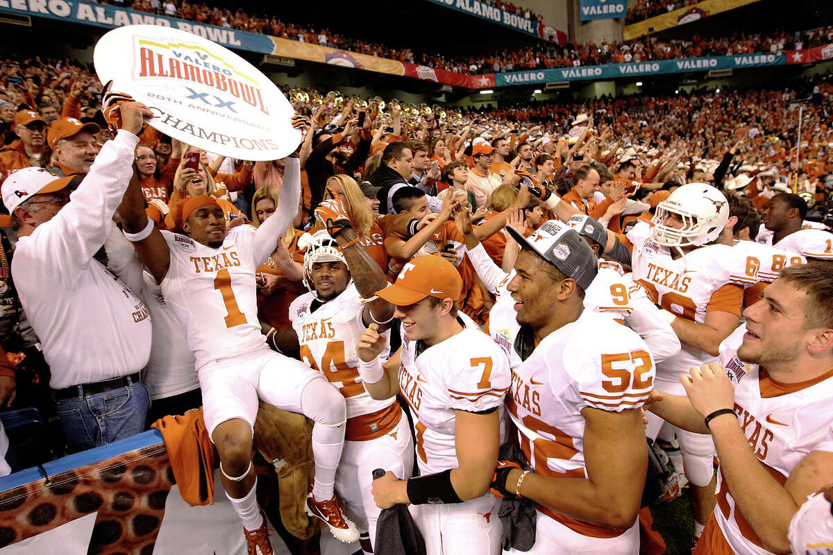 No state had a better 2012-13 bowl season than Texas. The Lone Star State was only a late TCU fumbled punt from notching a perfect 7-0 record. Express-News college football beat writer Tim Griffin breaks down the state schools’ postseason play: PHOTO: Texas' Mike Davis (01) holds a sign to signify the Longhorns' victory over Oregon State as fellow players and fans celebrate at the Valero Alamo Bowl on Dec. 29, 2012. Texas won 31-27.