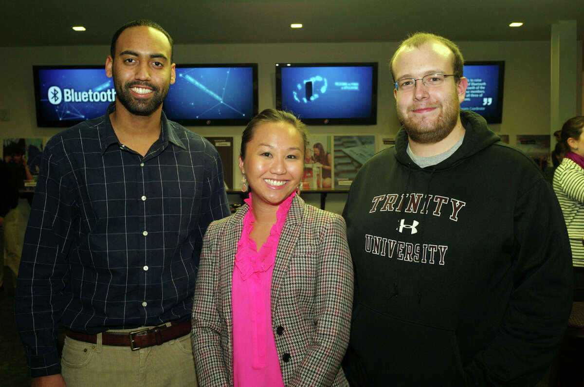 OTS/HEIDBRINK - Trinity University alumni Stanton Burke, from left, and Annie Vu and Trinity student Michael Yancey gather at the Trinity University reception at Rackspace on 1/7/2013. This is #2 of 2 photos. names checked photo by leland a. outz