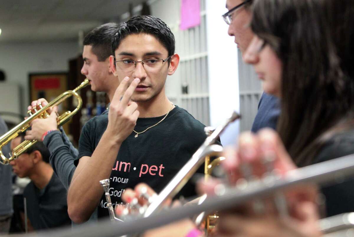 Diego Espinoza instructs the trumpet section during practice with the Waltrip High School Top Jazz Ensemble who is trying to raise money for the Waltrip H.S. Band to go the inauguration in Washington on Monday, Jan. 7, 2013, in Houston. They've already raised $110,000, but they still need $40,000 to $50,000 more to cover expenses for all 147 students in the band.
