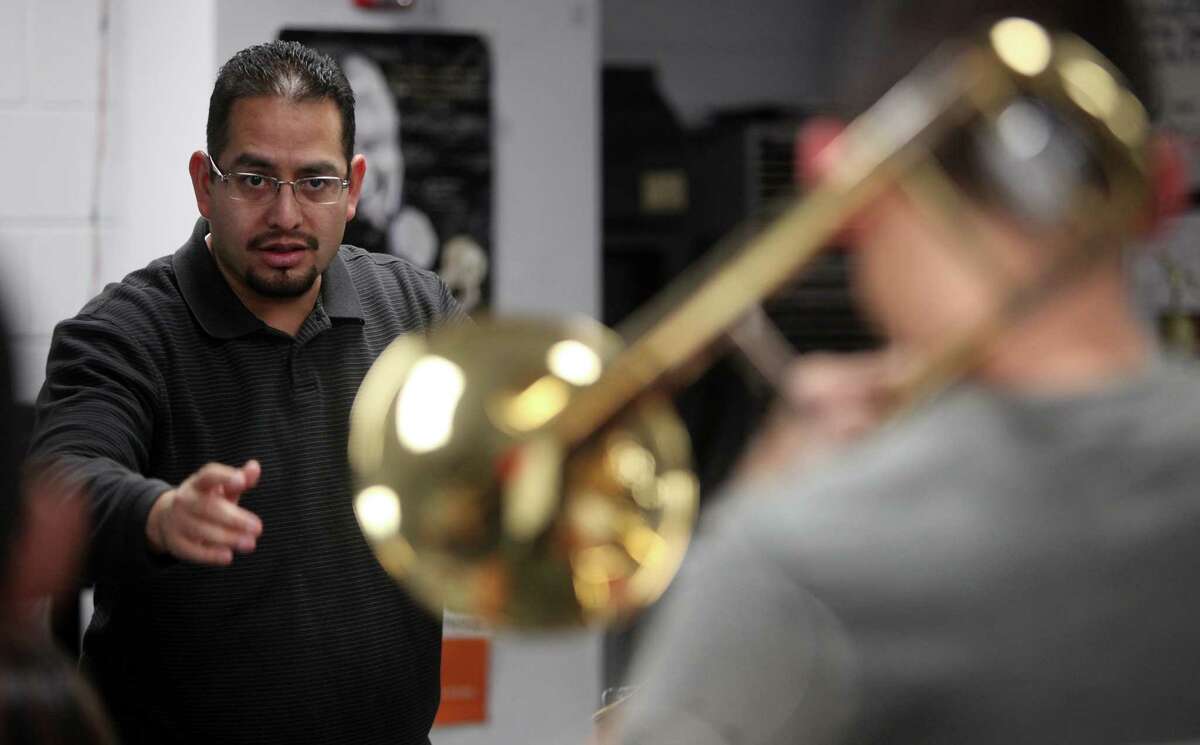 Jessie Espinoza, Waltrip High School Band Director, instructs the Top Jazz Ensemble during practice, as the school is trying to raise money for the Waltrip H.S. Band to go the inauguration in Washington on Monday, Jan. 7, 2013, in Houston. They've already raised $110,000, but they still need $40,000 to $50,000 more to cover expenses for all 147 students in the band.