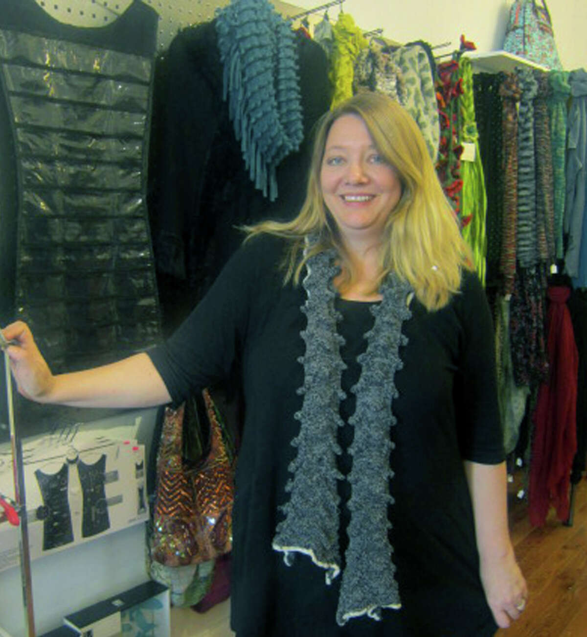 Shop owner Annie Nast offers a welcoming smile to patrons of Daffodil 6, a boutique on Bank Street in New Milford. November 2012