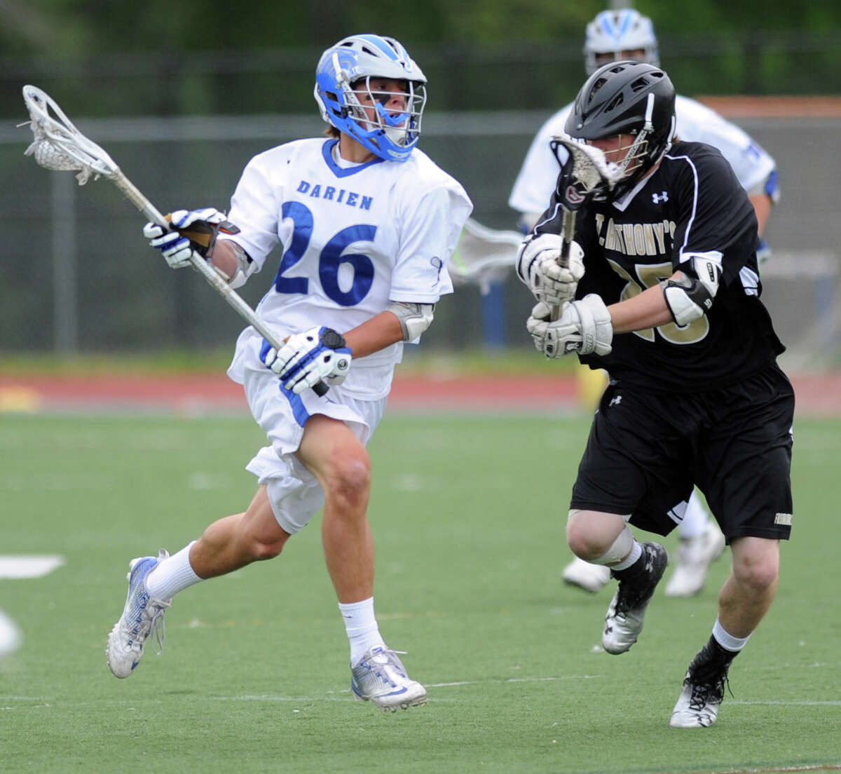 Darien's Peter Gesualdi controls the ball as he is defended by St. Anthony's Brendan Hurley during Saturday's game against St. Anthony's at Darien High School on May 5, 2012.