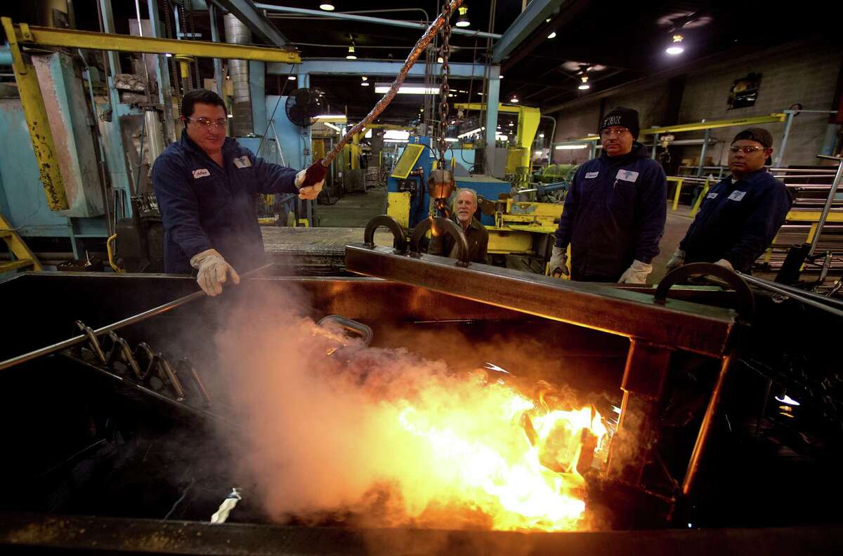 1/7/2013: Antonio Henriquez, Moris Contreras and Jose Zelaya, perform the hot coil process at Suhm Spring Works in Houston Texas. The three work together by removing 1.968 inch carbon steel from a 1700 degree furnace; then wrap the coil then move the coil to a 1200 degree oil quench. The coil is then moved from the oil quench to a resting plate where it cools down to 240 degrees. The springs are used for oil wells.