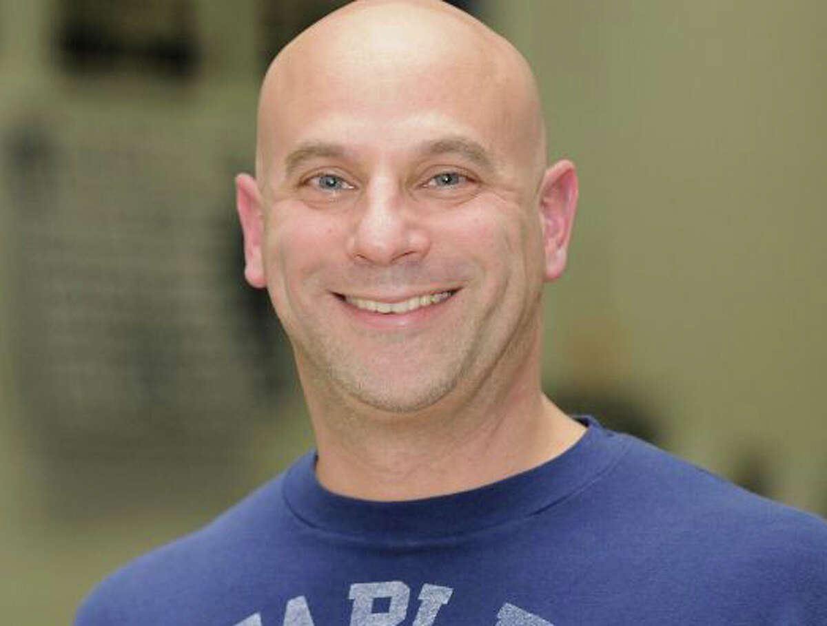 Valerie Wilke, a Fairfield social worker, has been charged with interfering with the police investigation into child sexual-assault allegations against Jeffrey Schare, pictured, a former Staples High School boys swim team coach.
