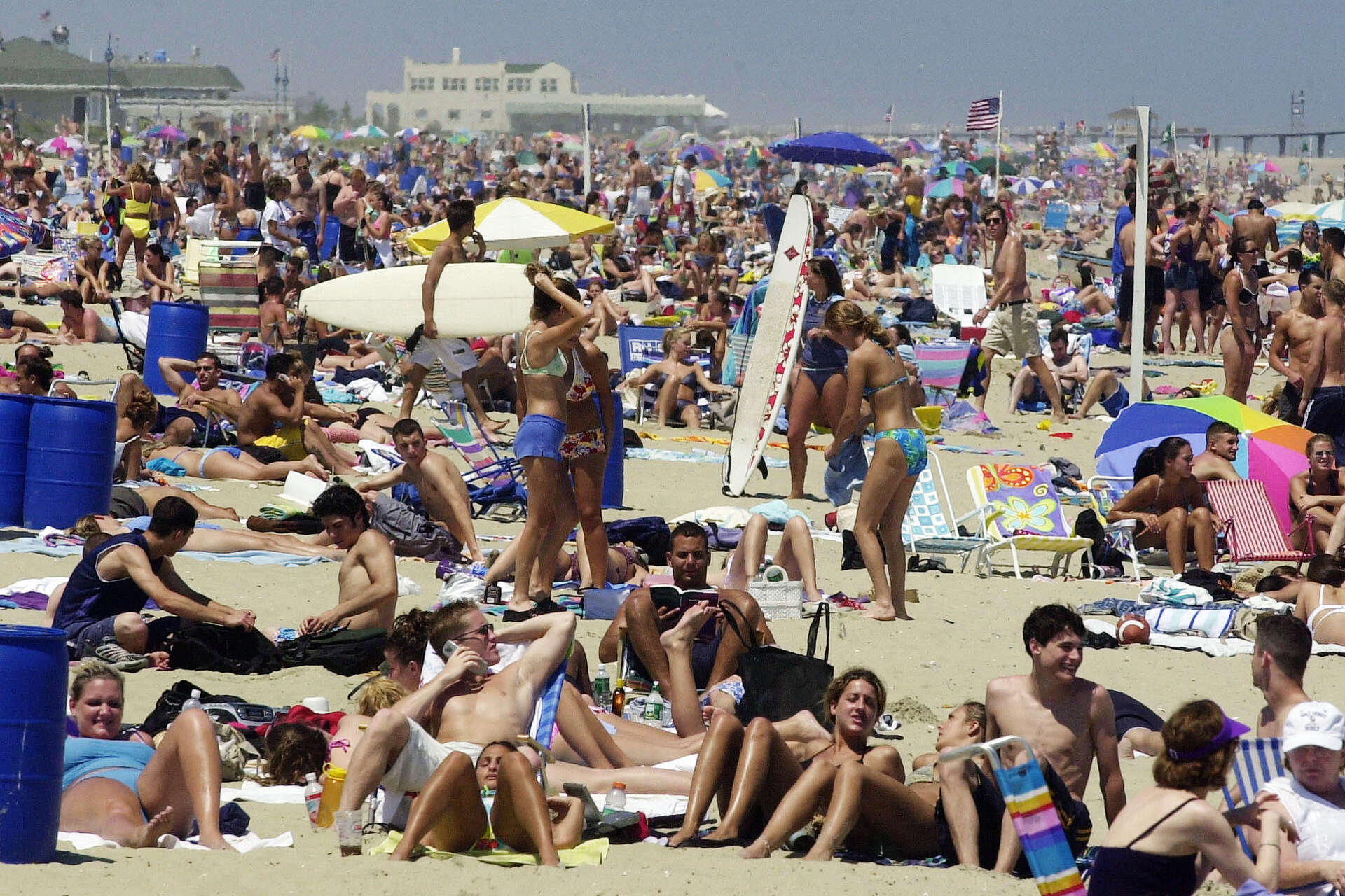 Visitors and residents spend the day on the beach in Belmar, N.J., on this first day of summer. (Associated Press)