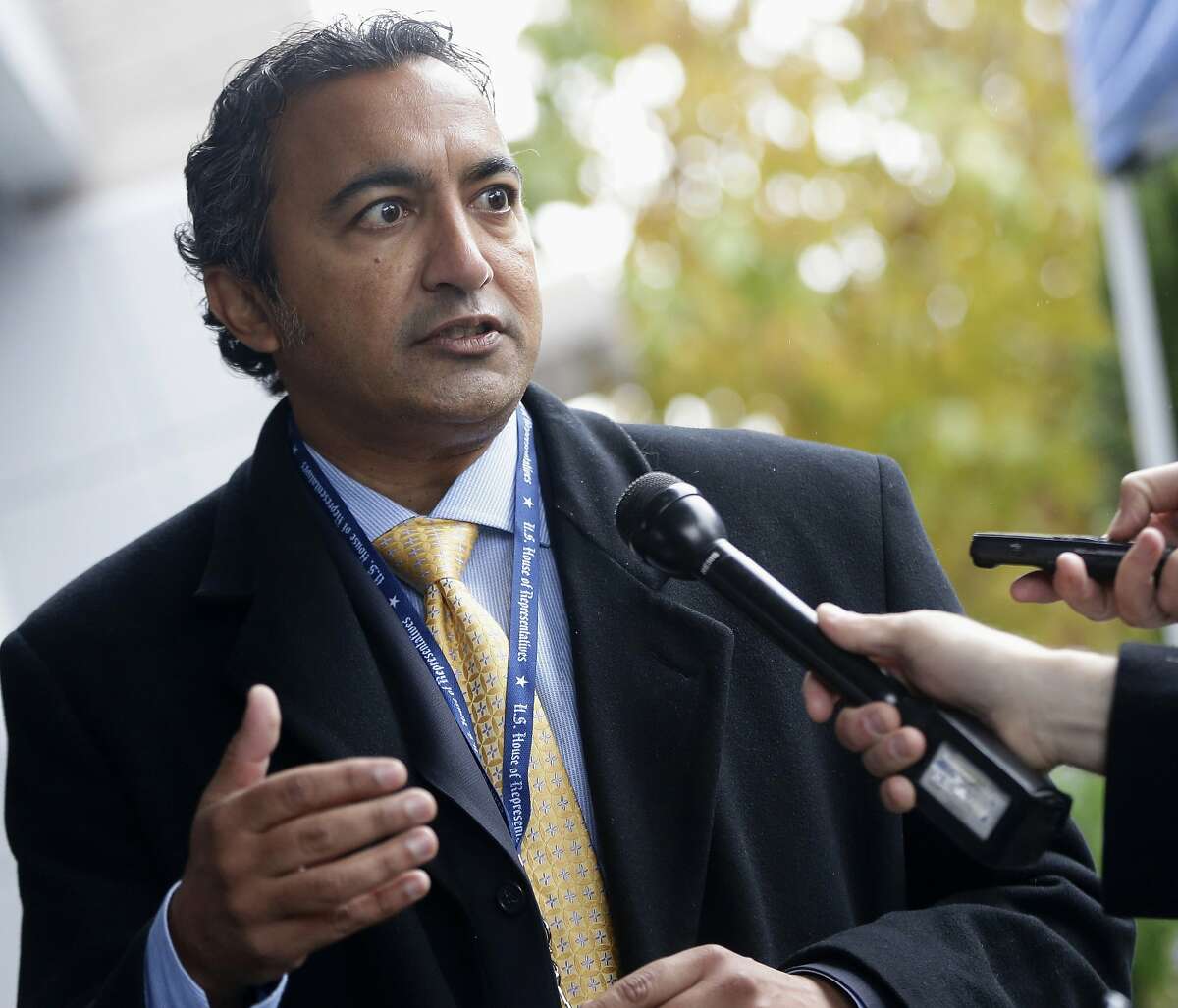 FILE - In this Nov. 13, 2012 file photo, then-Rep.-elect Ami Bera, D-Calif., speaks to reporters after he registered for orientation at a hotel as newly-elected members of Congress arrived on Capitol Hill in Washington. Democratic Rep. Tulsi Gabbard, of Hawaii, is the first Hindu elected to Congress. Bera, also a Democrat, is the third Indian-American to serve in the House. Gabbard, however, isn't from India, where Hinduism originated and the background shared by the vast majority of its adherents have ethnic ties. (AP Photo/Charles Dharapak, File)