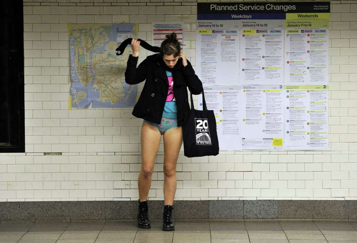 Some riders in the New York City subway in the underwear as the take part in the 2013 No Pants Subway Ride January 13, 2013. Started by Improv Everywhere, the goal is for riders to get on the subway train dressed in normal winter clothes (without pants) and keep a straight face. AFP PHOTO / TIMOTHY A. CLARYTIMOTHY A. CLARY/AFP/Getty Images
