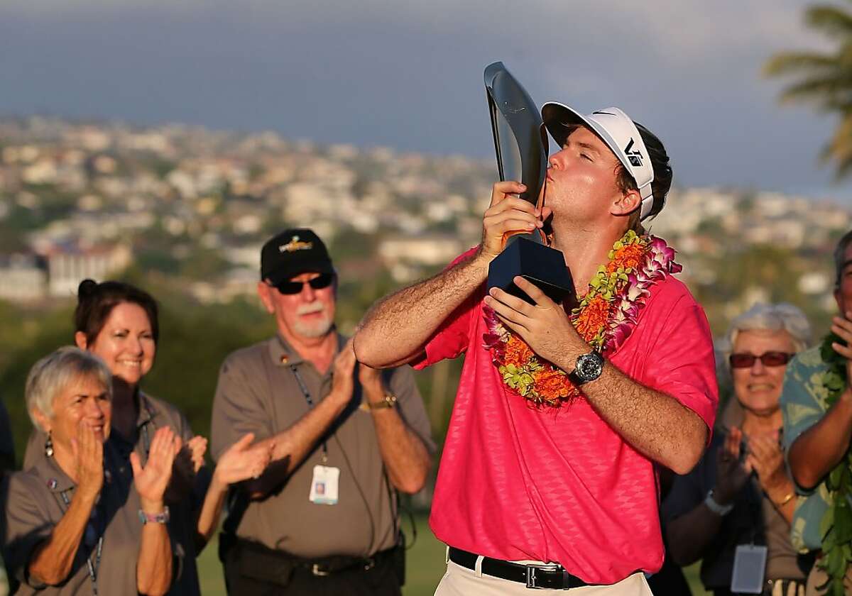 HONOLULU, HI - JANUARY 13: Russell Henley celebrates with the Sony Open in Hawaii trophy after winning in the final round at Waialae Country Club on January 13, 2013 in Honolulu, Hawaii. (Photo by Christian Petersen/Getty Images)
