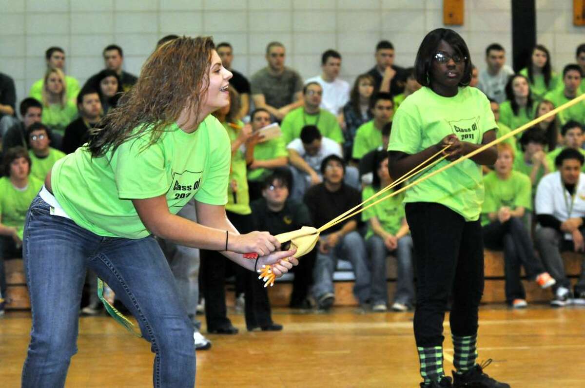 Junior Rebecca Malinowski, a Culinary student from Derby, slingshots a rubber chicken to her teammates during the Class Wars at Emmett O'Brien Technical School in Ansonia on Wednesday, Dec. 23, 2009.