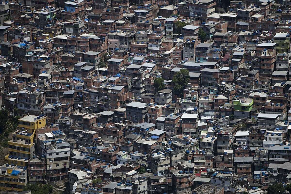 This Jan. 8, 2013 photo shows homes at the Rocinha slum in Rio de Janeiro. Five years ago, Rio de Janeiro's "favela" hillside slums had such a bad rap that they were virtual no-go zones, where drug lords laid down the law and outsiders set foot at their peril. But since 2011 police have seized control of dozens of favelas from drug gangs, and things have changed so dramatically that some are now seen as hot real estate investments. (AP Photo/Felipe Dana)