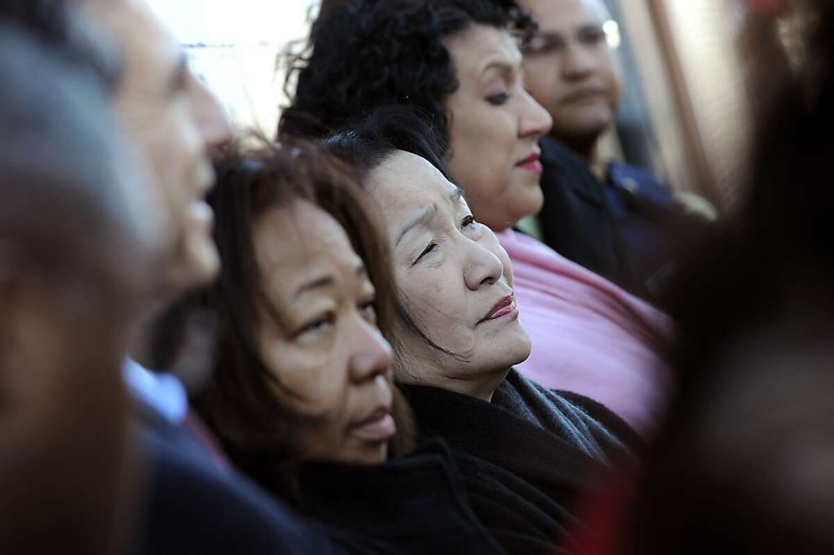 Mayor Jean Quan is seen with other members of her administration as they attend a press conference held on International Blvd. Oakland police, Mayor Jean Quan and City Administrator held a news conference to discuss the ongoing violence gripping Oakland, Monday January 14th, 2013.