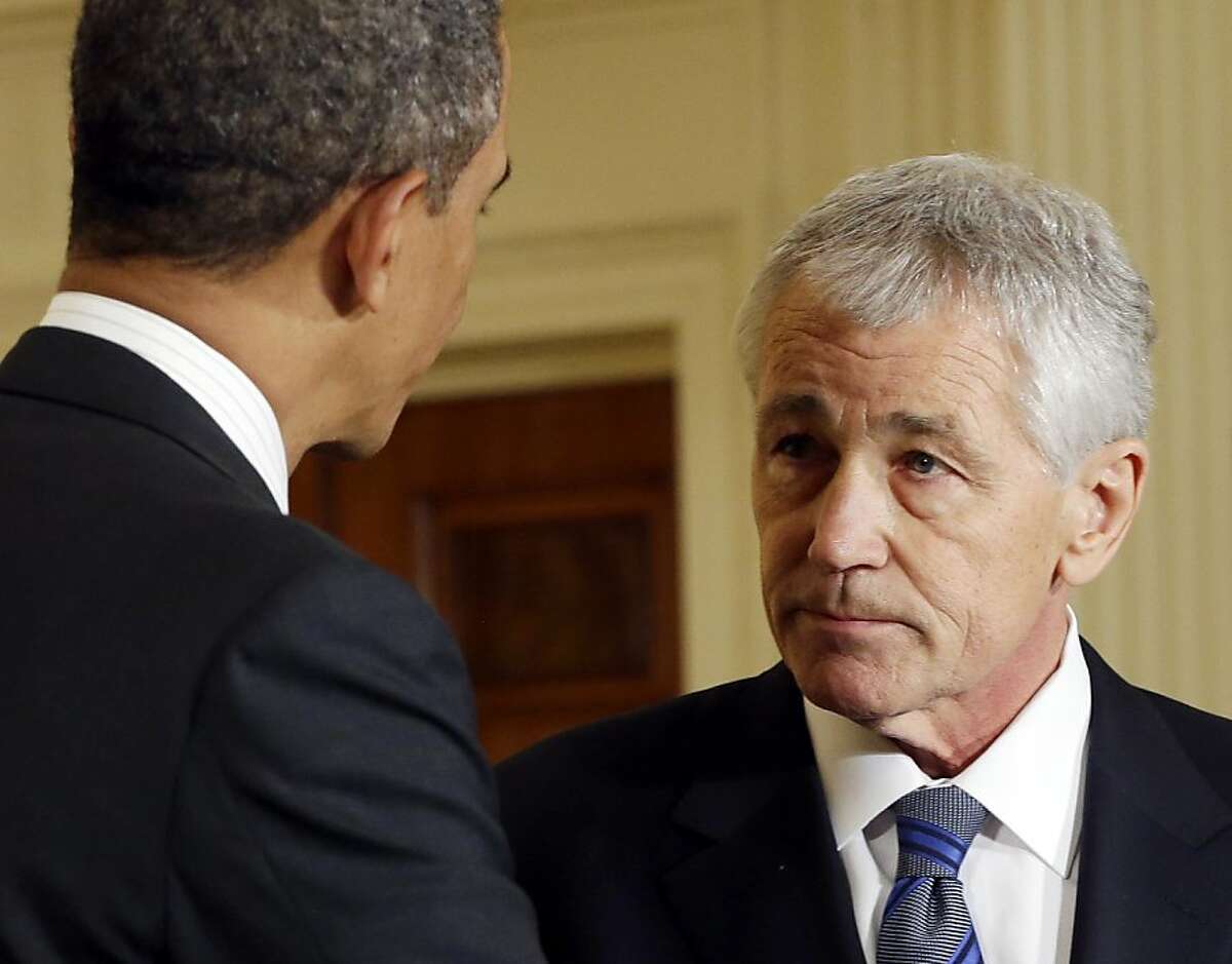 FILE - In this Jan. 7, 2013 file photo, President Barack Obama, left, shakes hands with his choice for Defense Secretary, former Nebraska Sen. Chuck Hagel, after announcing Hagel's nomination in the East Room of the White House in Washington. Hagel secured the backing of Sens. Chuck Schumer of New York and Barbara Boxer of California, two of the staunchest pro-Israel Senate Democrats, in a clear boost to the Republican's prospects of becoming President Barack Obama's next defense secretary. (AP Photo/Pablo Martinez Monsivais, File)