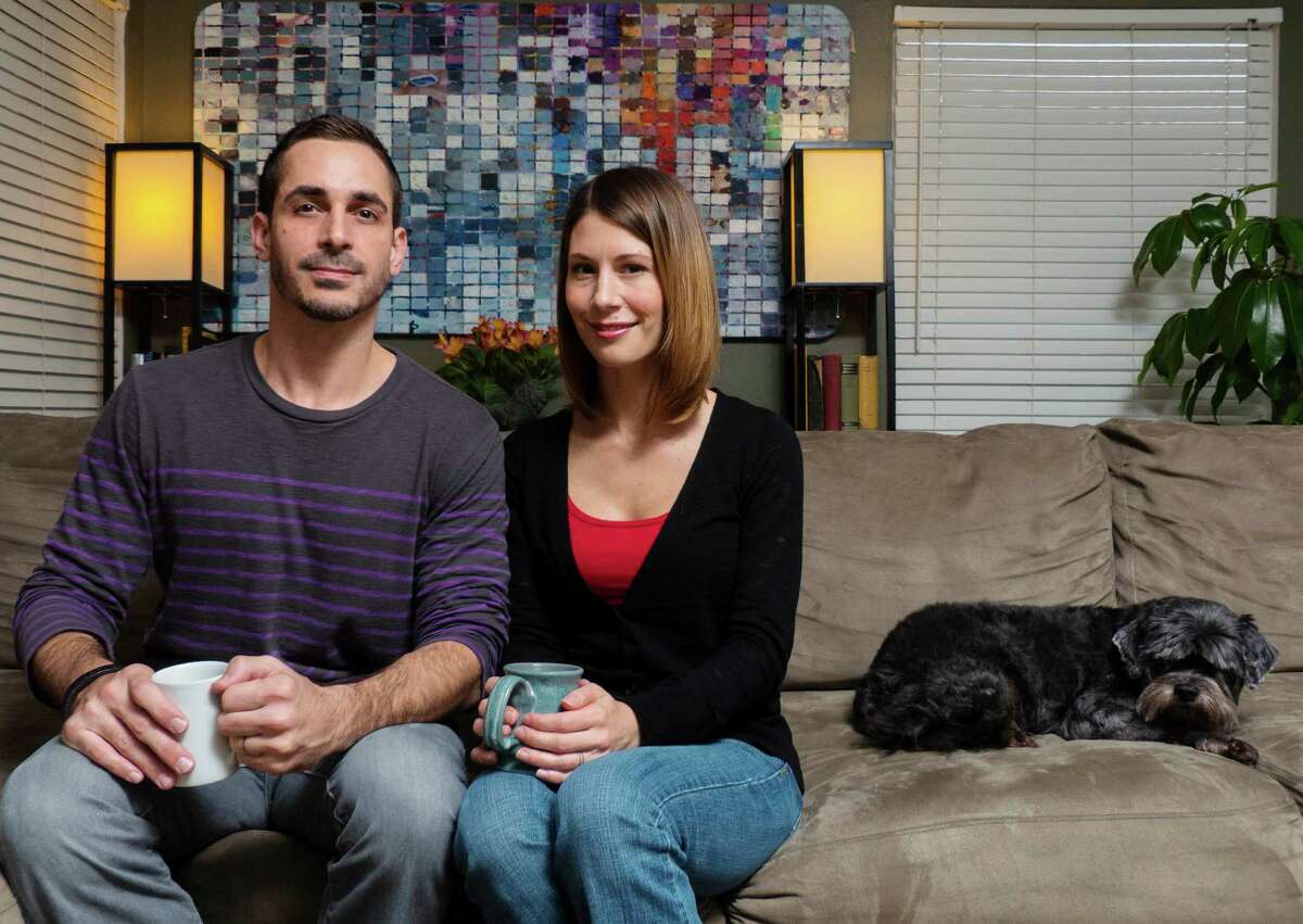 Franklin and Stephanie Lyons, the couple behind SpinFall game apps, relax in their San Antonio home. They have developed a hit game app called "Frog on Ice."