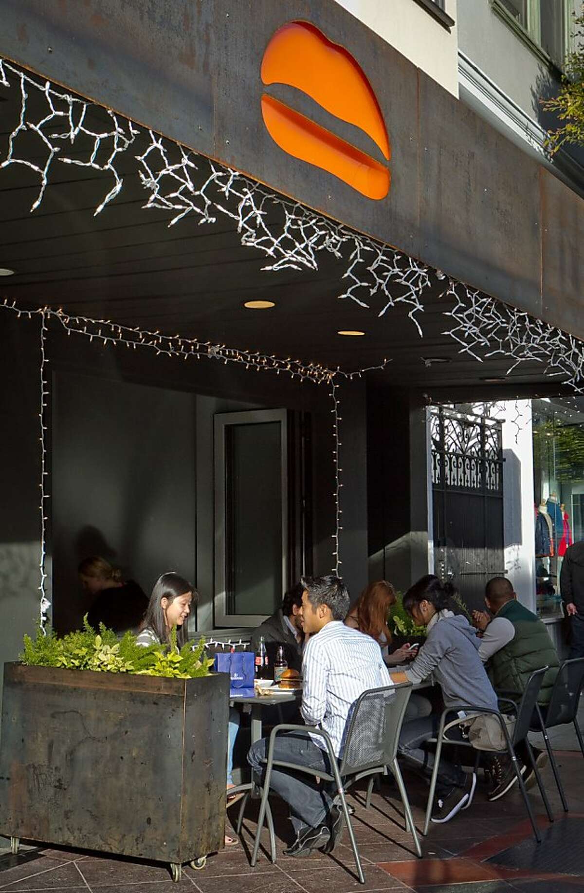 Diners enjoy lunch outside at Umami Burger in San Francisco, Calif., on Sunday, January 8th, 2012.