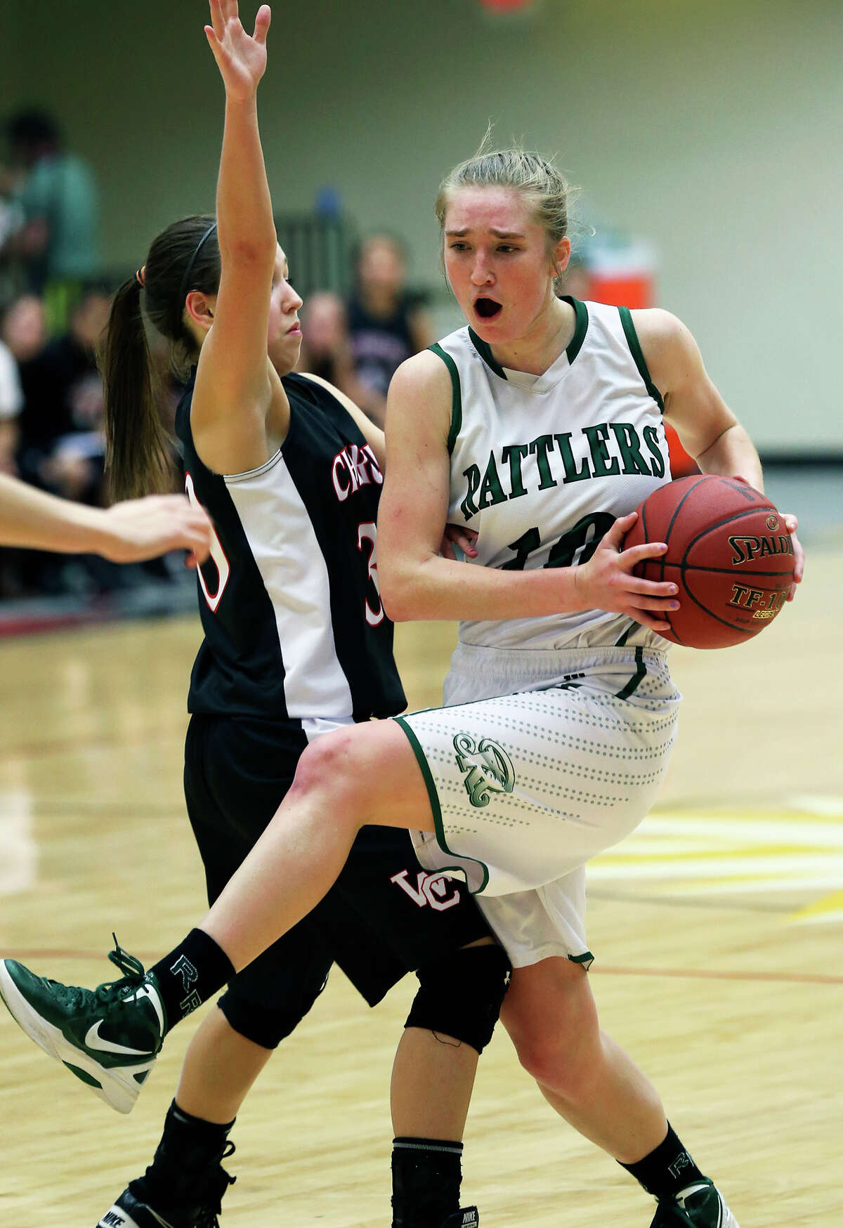 Wendy Knight tugs away a pass for the Rattlers as the Reagan girls play Churchill at Littleton Gym on January 15, 2013.