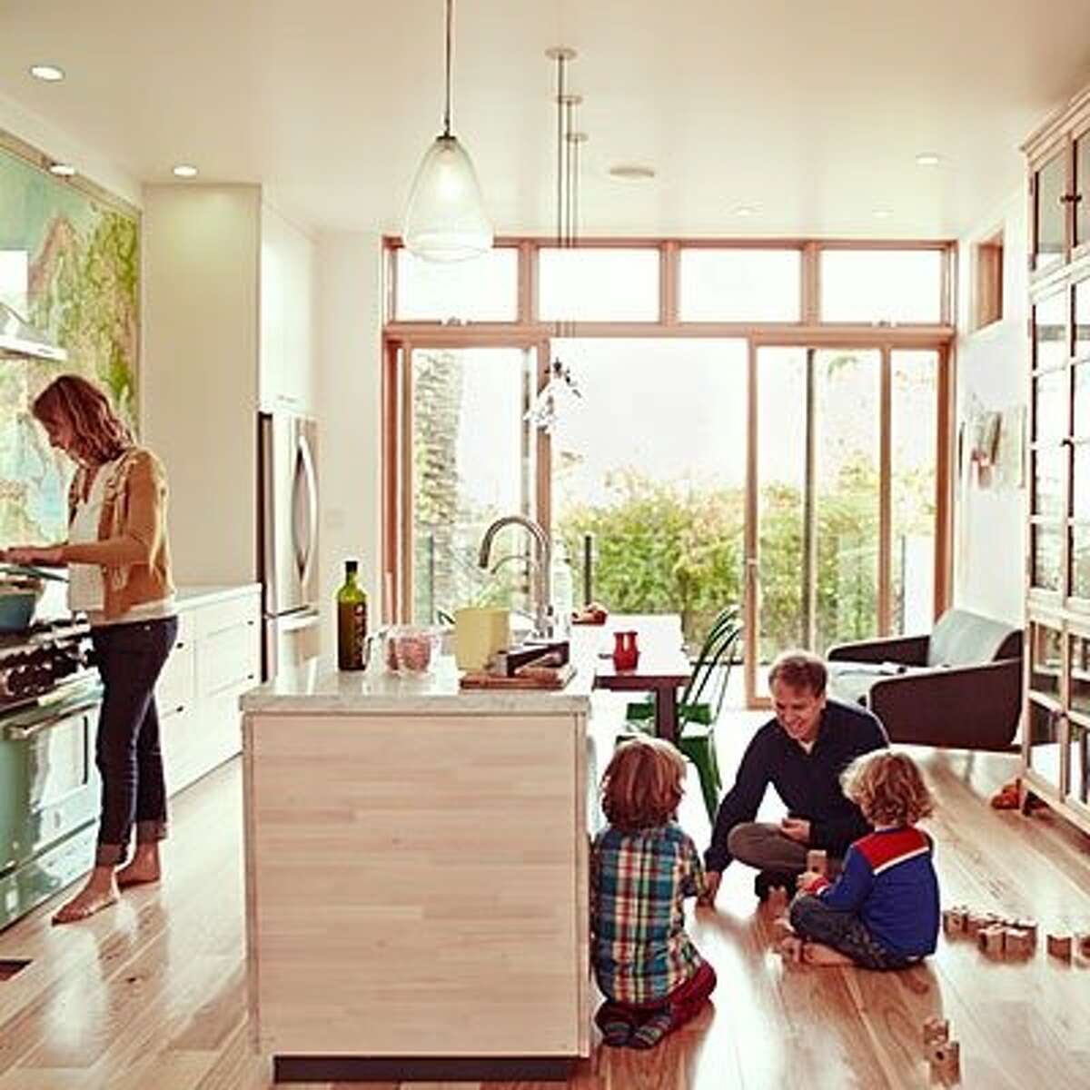 Modern meets old-school: Modern lines and electricity are present in the kitchen, but there are no digital interfaces on those shiny appliances. On the floor, the kids play with toys like wood blocks, not video games. Read more: The unplugged home