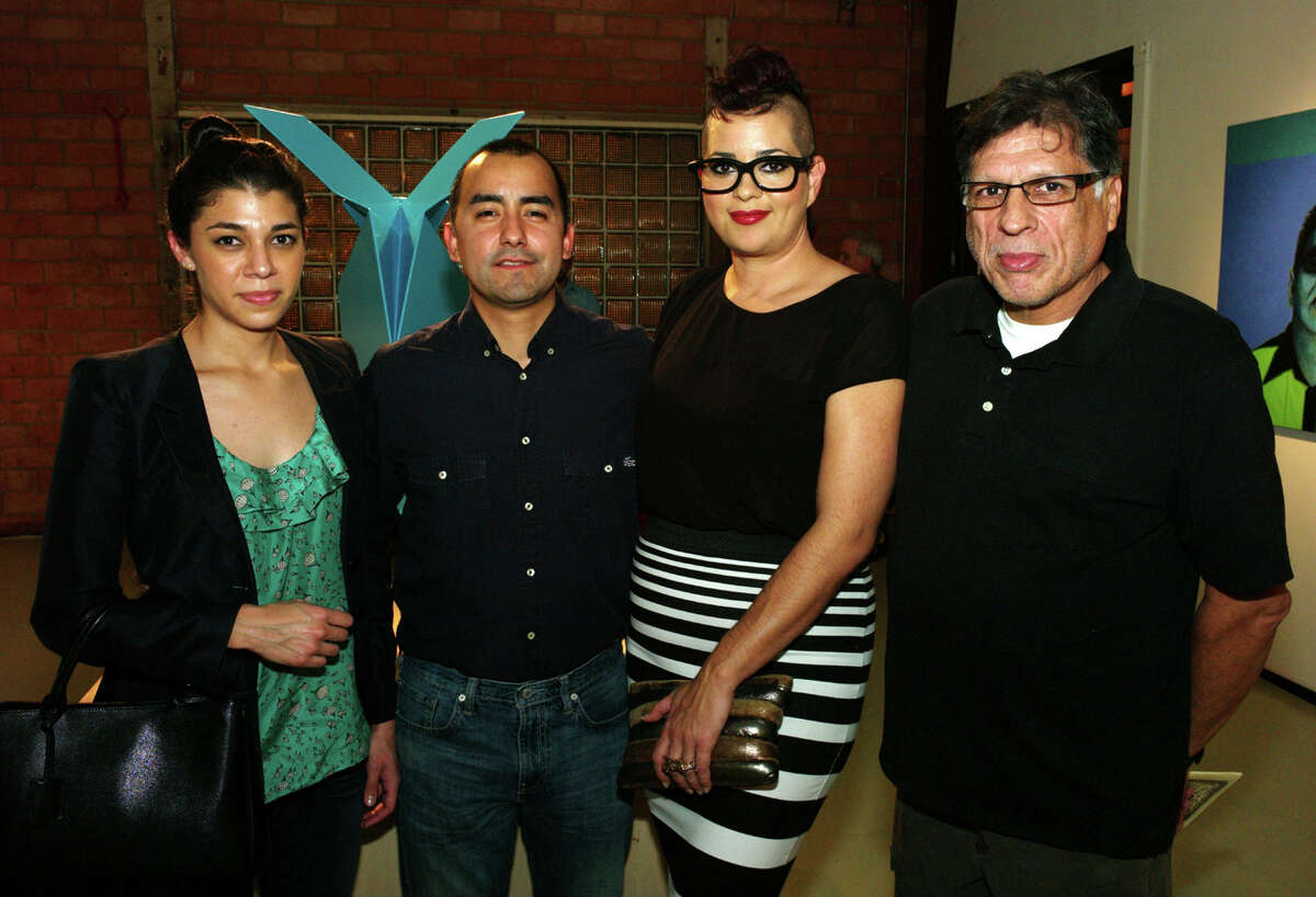 OTS/HEIDBRINK - Artists Adriana Coral, from left, Vincent Valdez, supporter Chris Davila and artist John Hernandez gather at the L.A./S.A. exhibit at Gravelmouth Gallery on 1/12/2013. This is #2 of 2 photos. names checked photo by leland a. outz