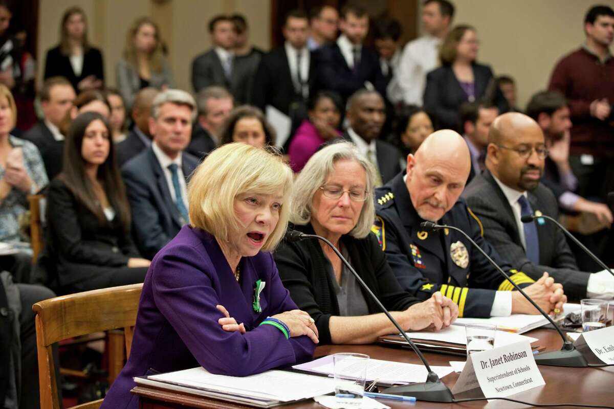 Newtown, Conn. School Superintendent Janet Robinson, left, testifies on Capitol Hill in Washington, Wednesday, Jan. 16, 2013, before a special hearing on gun violence held by the House Democratic Steering and Policy Committee. From left are, Robinson, Emily Nottingham, mother of Tucson shooting victim Gabe Zimmerman, Chaska, Minn. Police Chief Scott Knight, and Philadelphia Mayor Michael Nutter.