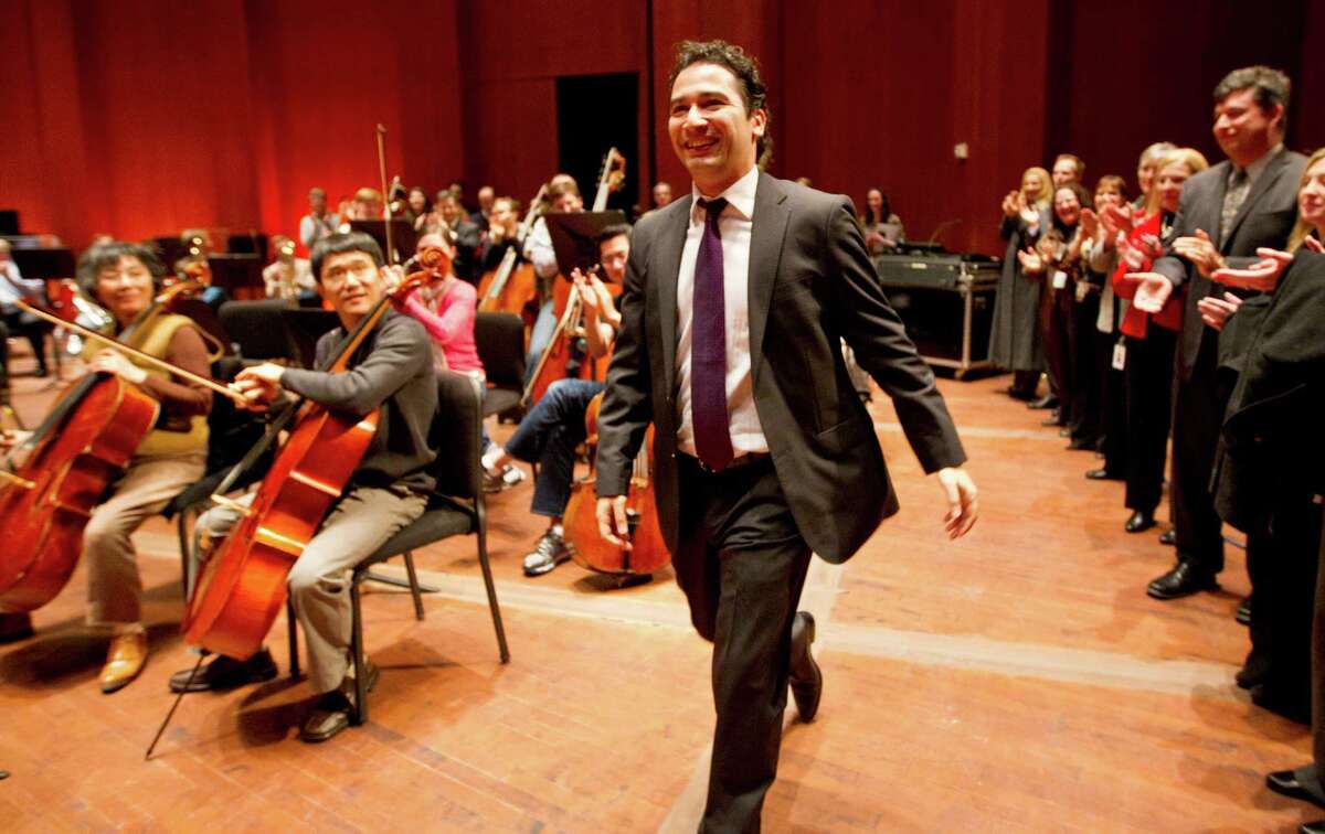 Andrés Orozco-Estrada walks on stage Wednesday at Jones Hall to the applause of the Houston Symphony after being named music director. At 35, he’ll also be among the youngest conductors of a major U.S. orchestra.