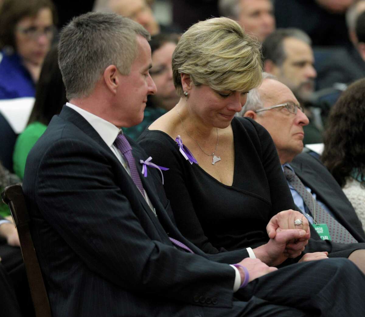 Lynn and Chris McDonnell, parents of Grace McDonnell who was killed in the Newtown, Conn. school shooting, listen as President Barack Obama talks about their daughter during a news conference on proposals to reduce gun violence, Wednesday, Jan. 16, 2013, in the South Court Auditorium at the White House in Washington.