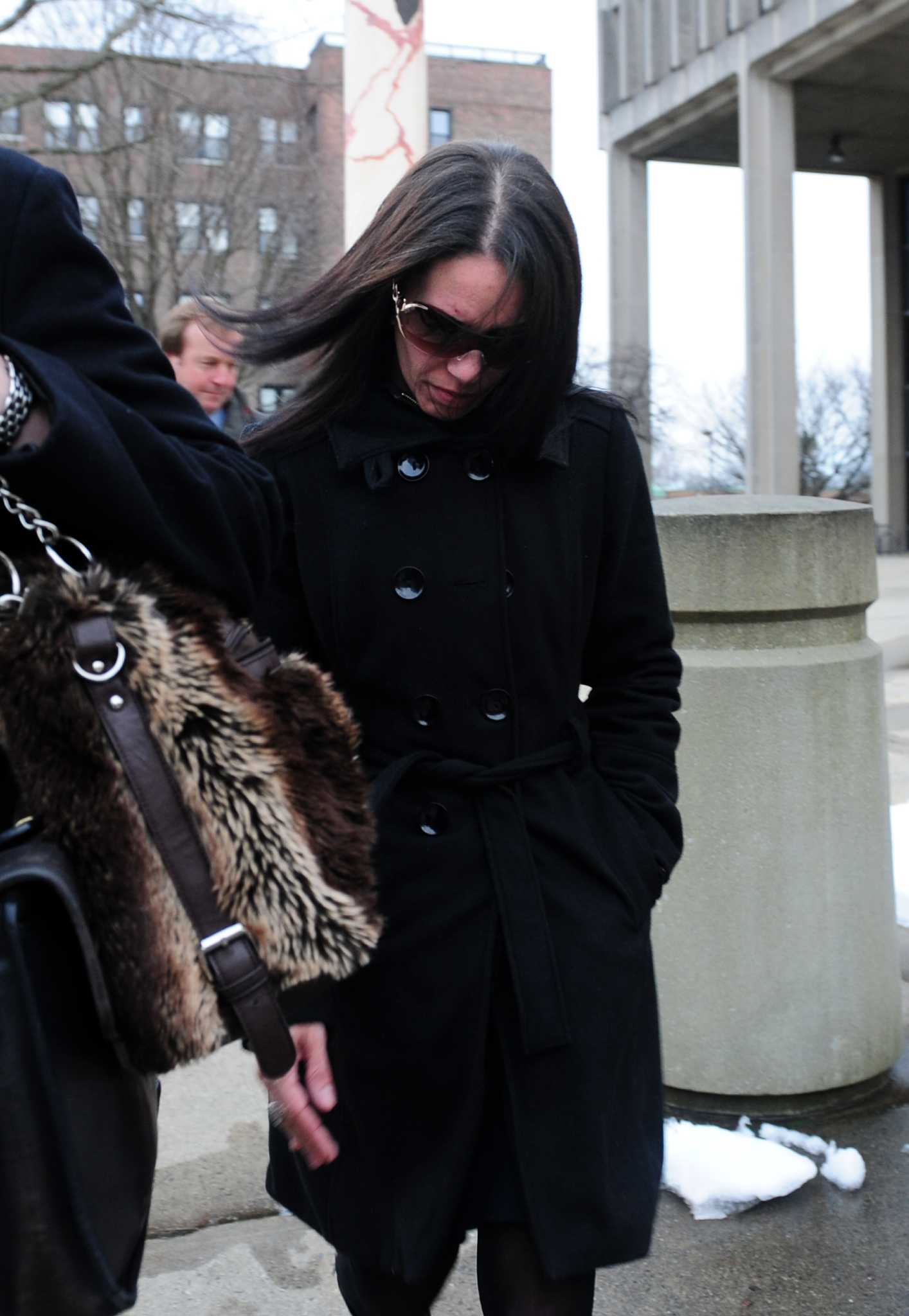 Woman accused of scamming donors to Newtown families pleads not guilty