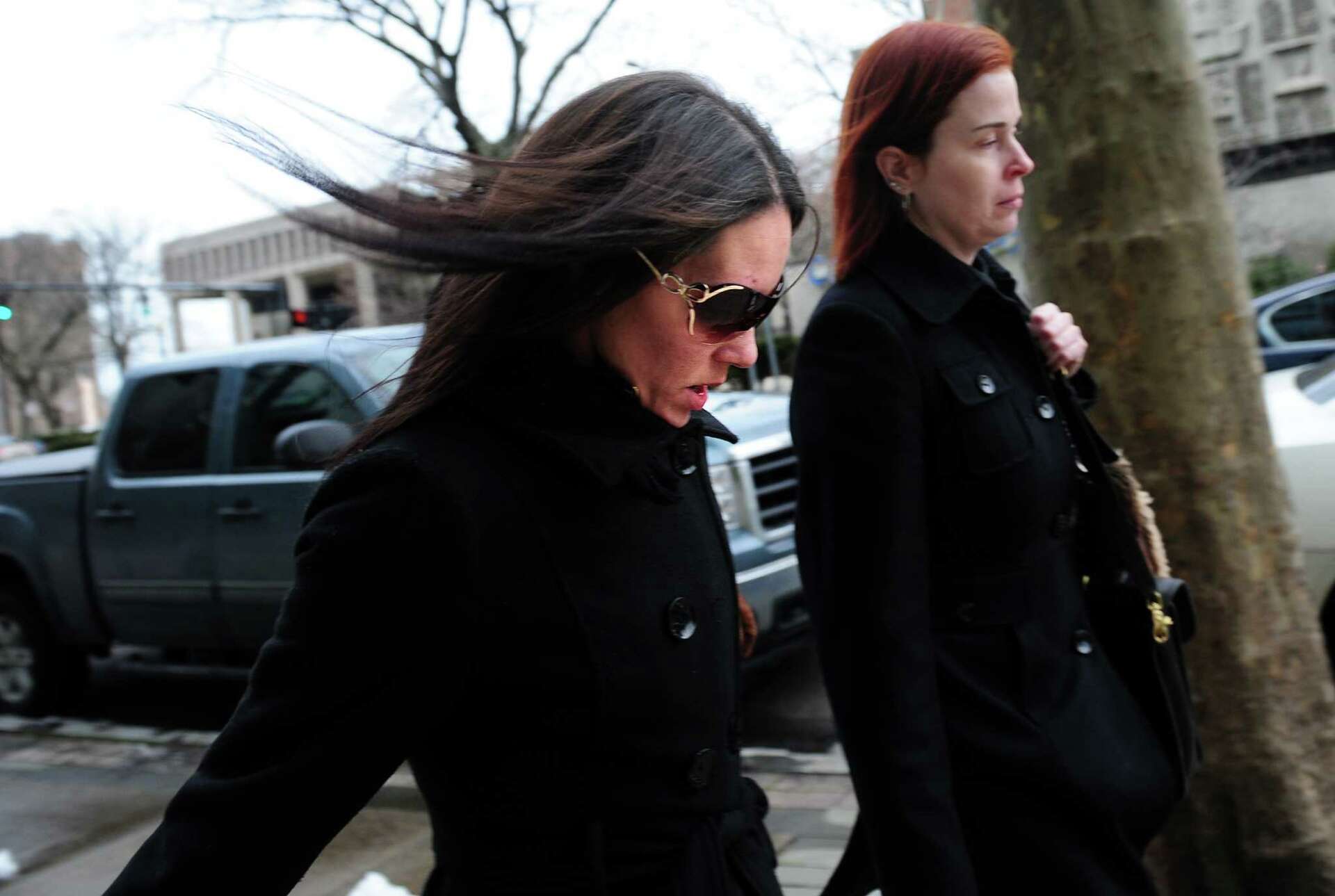 Woman accused of scamming donors to Newtown families pleads not guilty