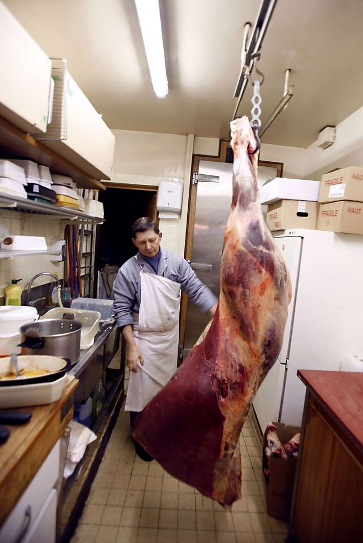 (FILES) In this file picture taken on January 18, 2007 a butcher prepares horse-meat at a specialist butchers shop in Paris. British Prime Minister David Cameron voiced concern about the "extremely disturbing" discovery of horsemeat in beefburgers sold in supermarket giants. While horsemeat is a common sight in central Asia, China, Latin America and parts of Europe, it is considered taboo by most British and Irish consumers. AFP PHOTO/CHRISTOPHE SIMONCHRISTOPHE SIMON/AFP/Getty Images