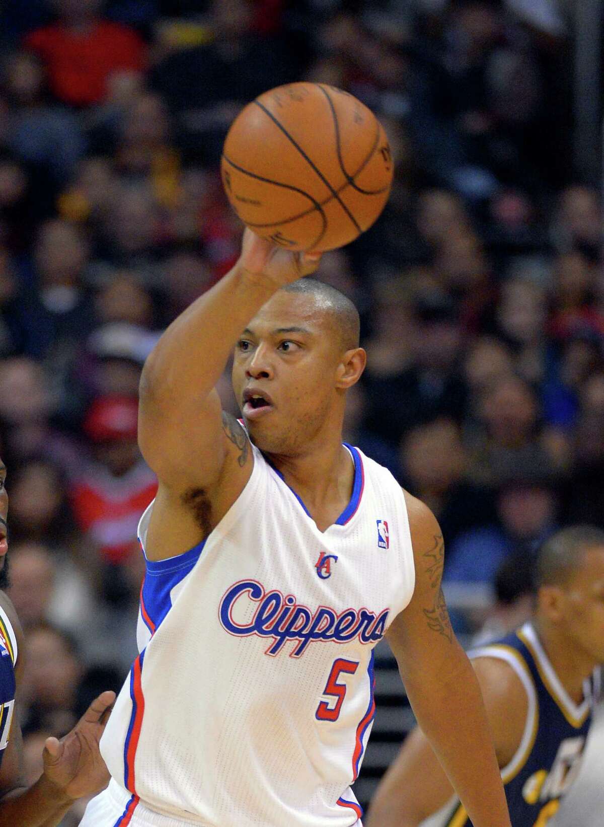 Los Angeles Clippers forward Caron Butler passes during the first half of their NBA basketball game against the Utah Jazz, Sunday, Dec. 30, 2012, in Los Angeles. (AP Photo/Mark J. Terrill)