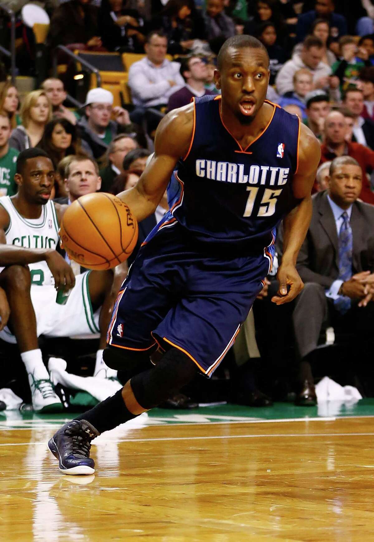 BOSTON, MA - JANUARY 14: Kemba Walker #15 of the Charlotte Bobcats drives to the basket against the Boston Celtics during the game on January 14, 2013 at TD Garden in Boston, Massachusetts. NOTE TO USER: User expressly acknowledges and agrees that, by downloading and or using this photograph, User is consenting to the terms and conditions of the Getty Images License Agreement. (Photo by Jared Wickerham/Getty Images)