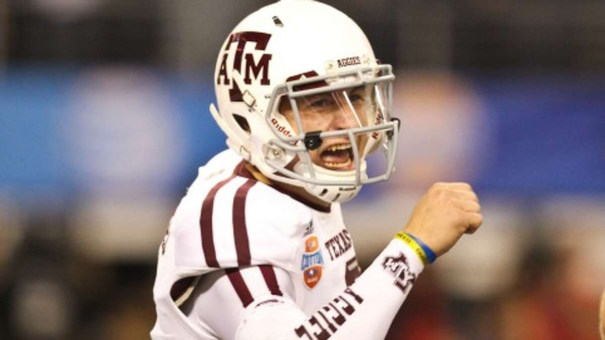 Texas A&M quarterback Johnny Manziel is winning on and off the field. (Nick de la Torre/Chronicle)