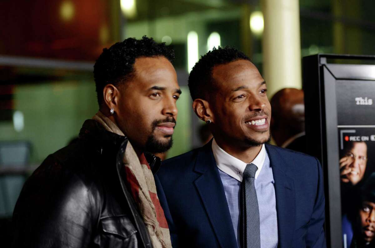 LOS ANGELES, CA - JANUARY 03: Actor Shawn Wayans (L) and co-writer/producer/actor Marlon Wayans arrive at the premiere of Open Road Films' "A Haunted House" at the Arclight Theatre on January 3, 2013 in Los Angeles, California. (Photo by Kevin Winter/Getty Images)