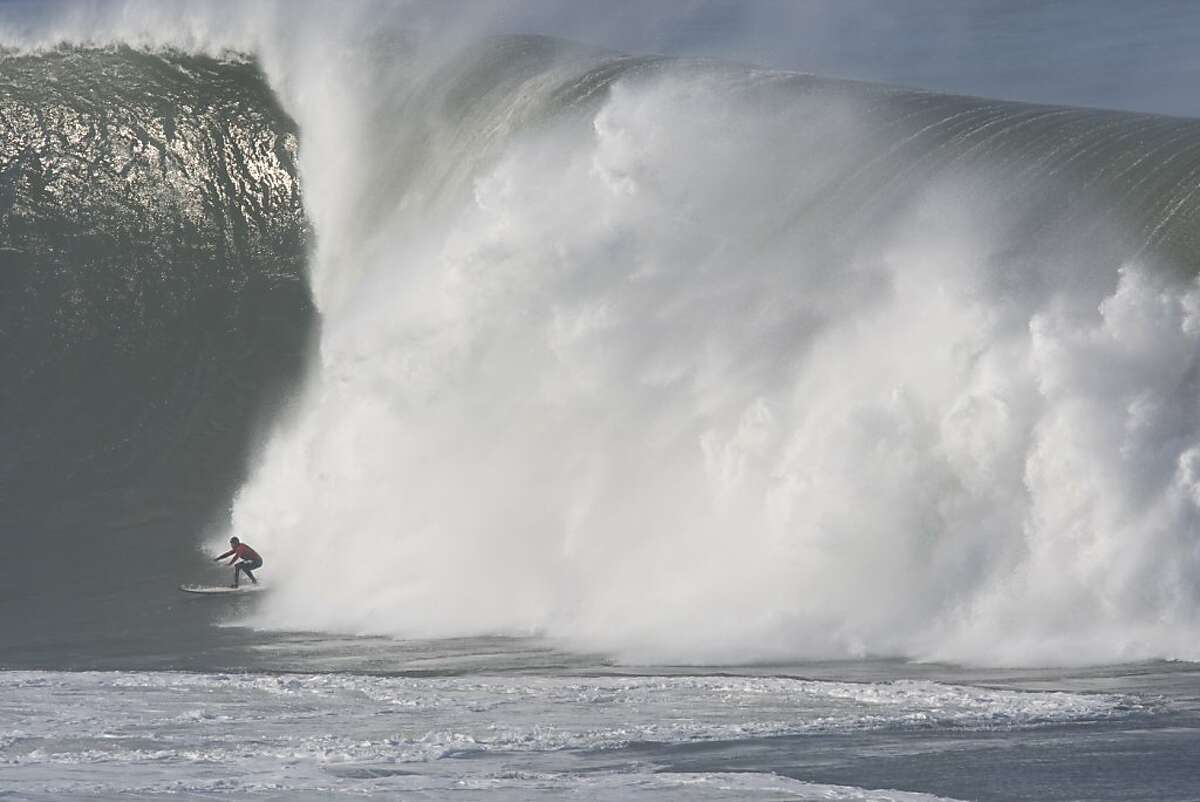 An unidentified surfer competes in the first round heats of the Mavericks Surf Contest in Half Moon Bay on Saturday.