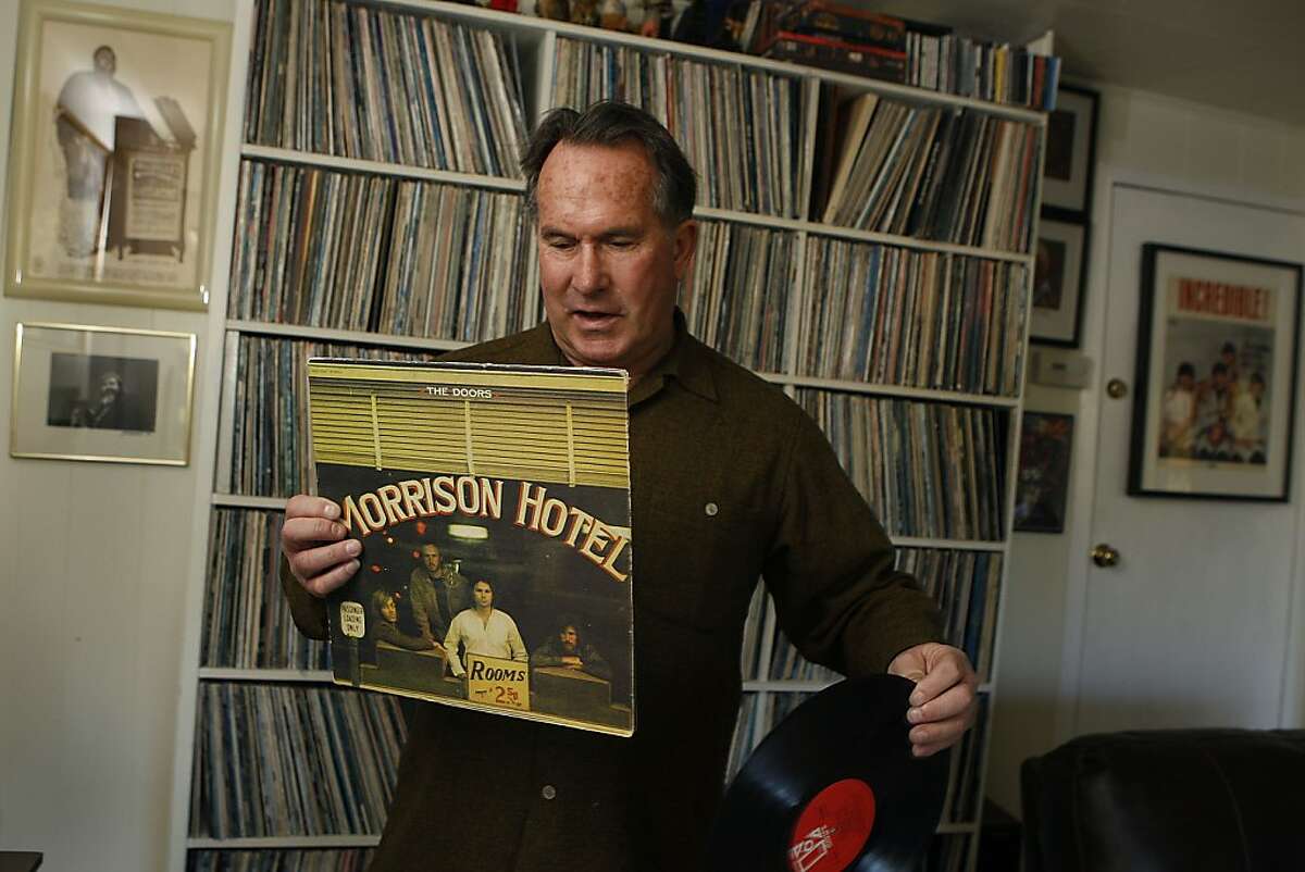 Documentary filmmaker Eric Christensen showing his Doors album collection at home in Mill Valley, Calif., on Wednesday, January 16, 2013.