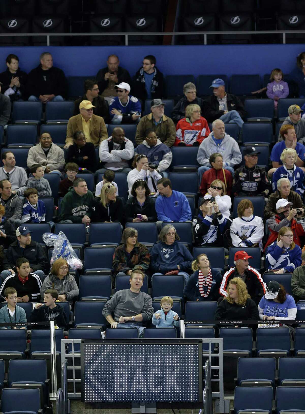 Tampa Bay Lighting fans watch the team during NHL hockey training camp, Friday, Jan. 18, 2013, in Tampa, Fla. The Lightning open their 48-game season against the Washington Capitals on Saturday night. (AP Photo/Chris O'Meara)
